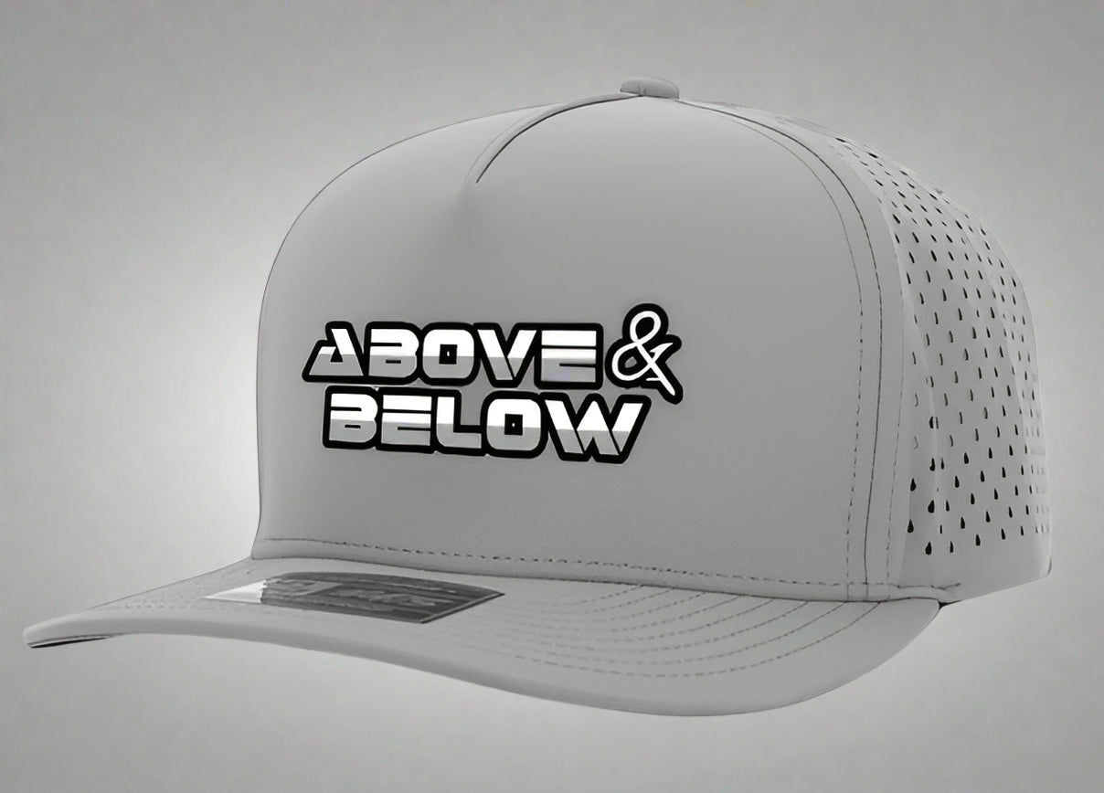 ⭐ Features
Streamlined 5-panel design for a minimalist and contemporary appearance
Made from a premium polyester and Spandex blend for comfort, flexibility, and long-lasting durability
Moisture-wicking & antimicrobial sweatband keeps you fresh all day long
Waterproof construction for reliable protection against the elements
Lightweight build ensures effortless comfort — even on the hottest days
Snapback closure allows for personalized and secure fit
Embroidered Above & Below logo on front panel
One size fit